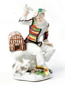 GERMAN PORCELAIN FIGURE OF HARLEQUIN